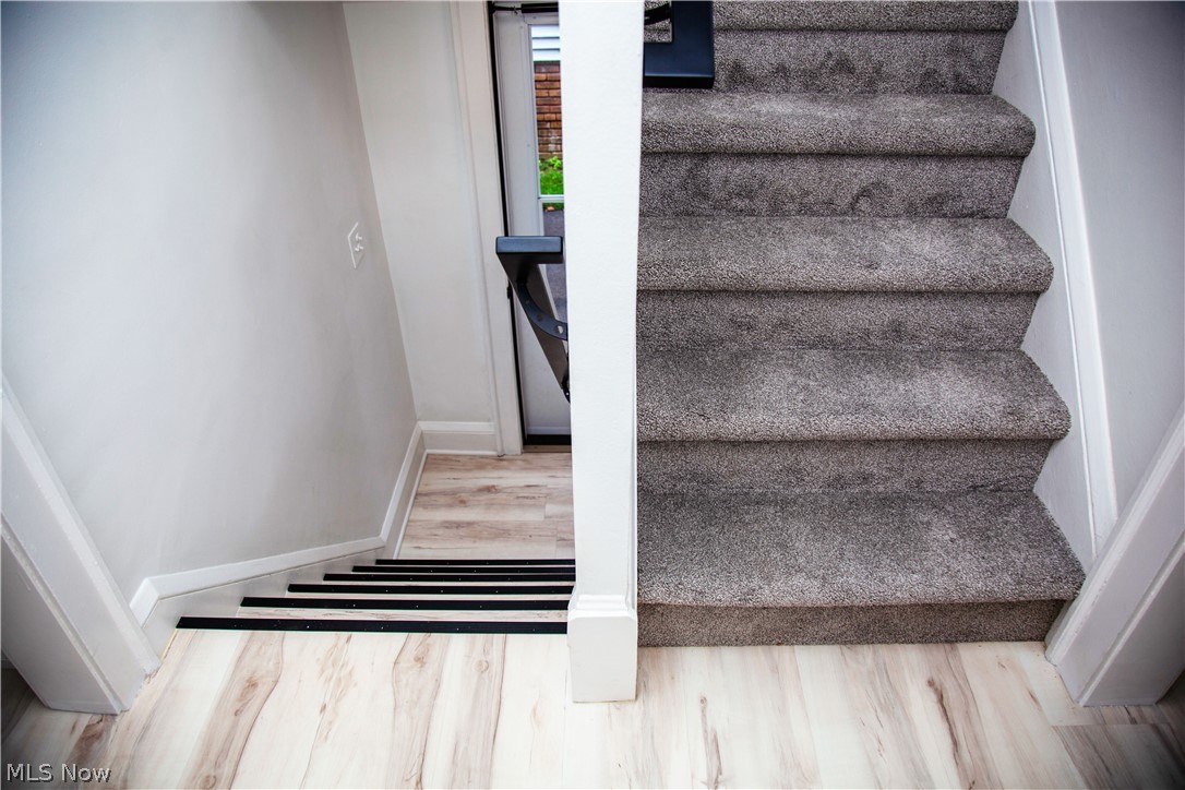 3554 Ludgate Road Shaker Heights, OH 44120 - Photo 22 of 50 Side door entry leading to hallway with carpeted staircase