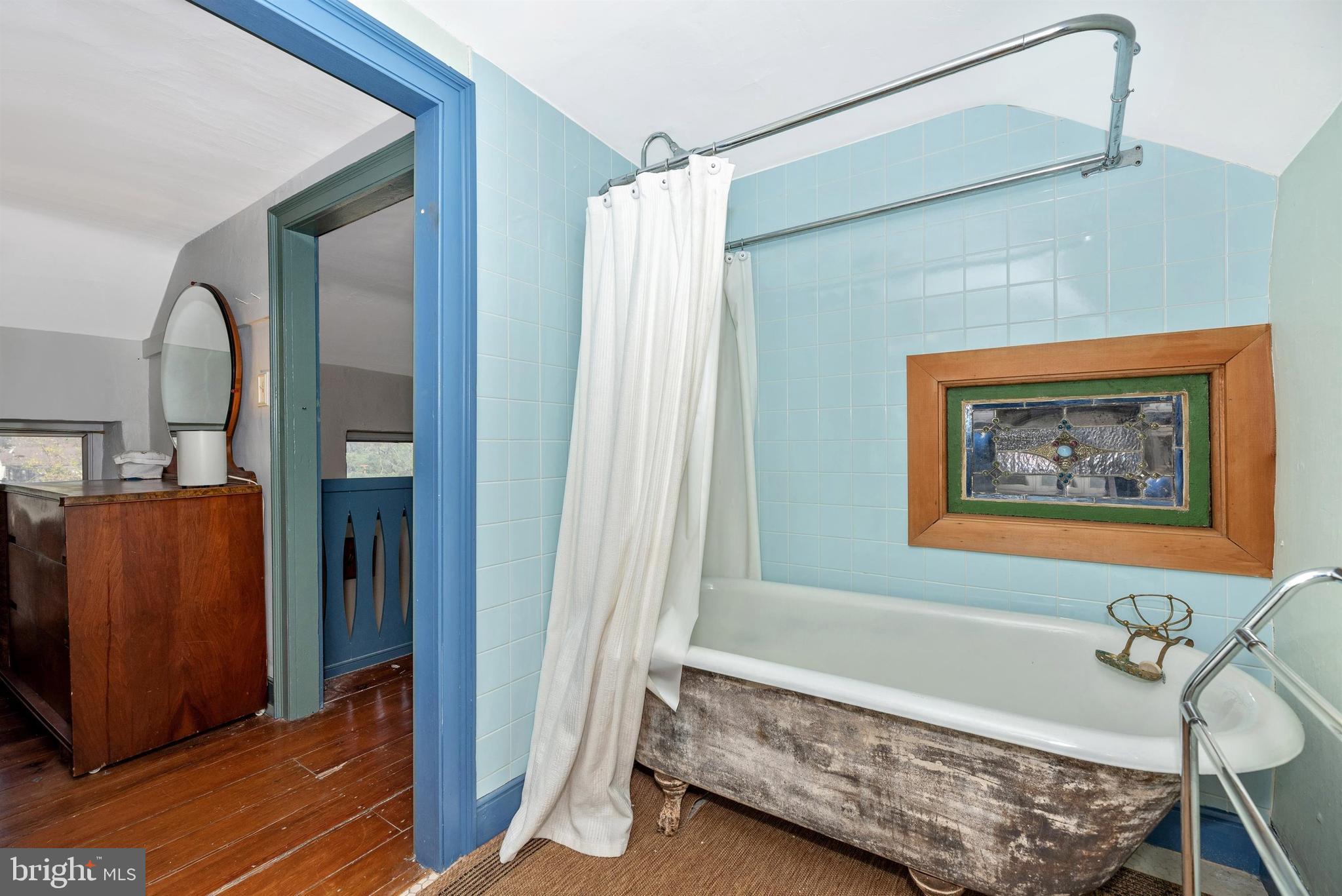 6112 Ford Road Frederick, MD 21702 - Photo 32 of 56 Clawfoot tub and stained glass window.