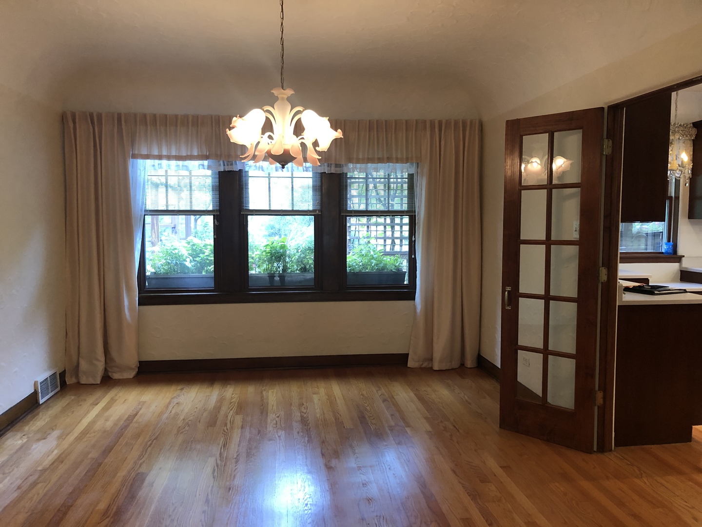 526 Longcommon Road Riverside, IL 60546 - Photo 2 of 40 a room with wooden floor and large windows