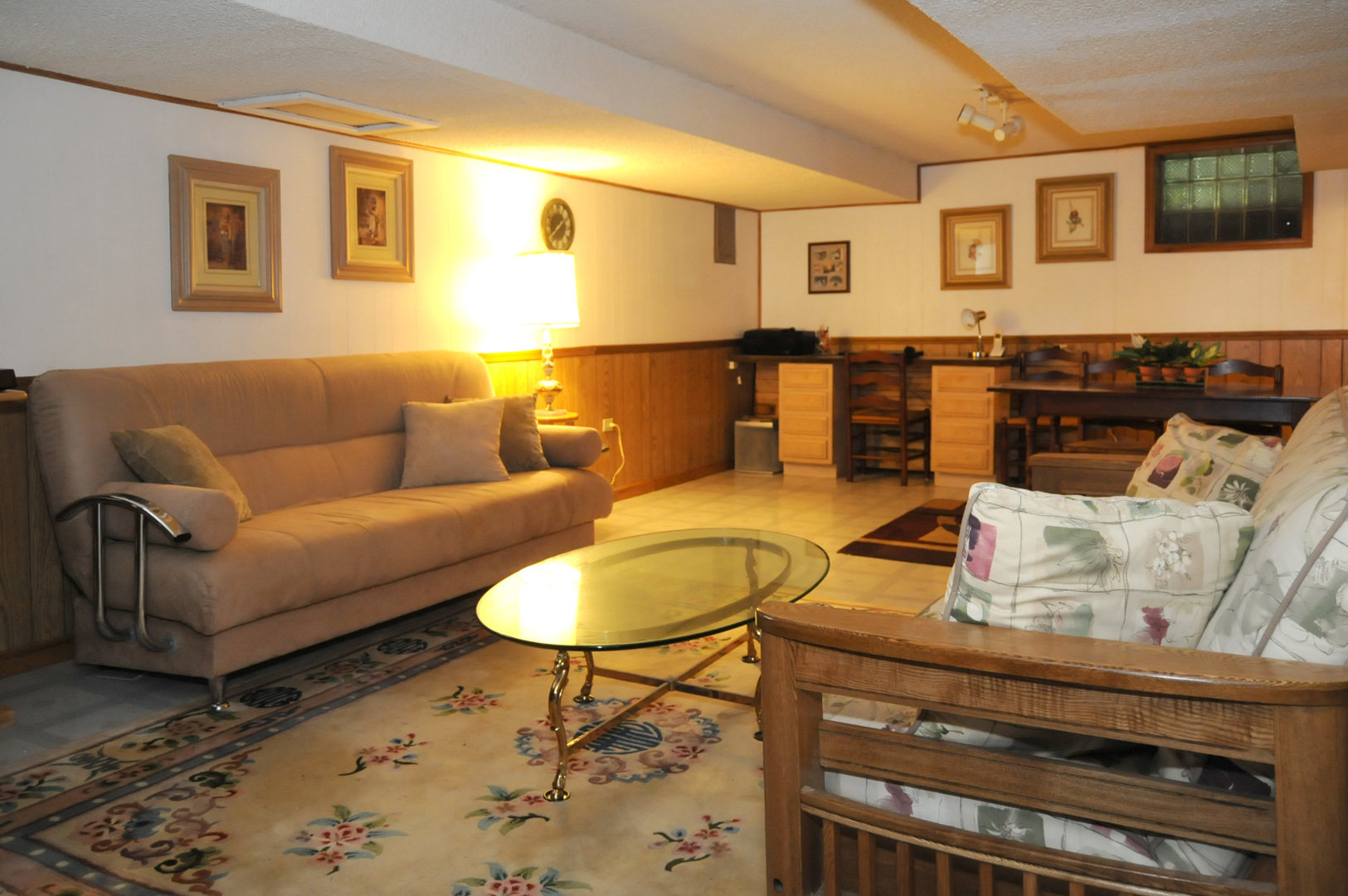 526 Longcommon Road Riverside, IL 60546 - Photo 24 of 40 a living room with furniture a flat screen tv and kitchen view