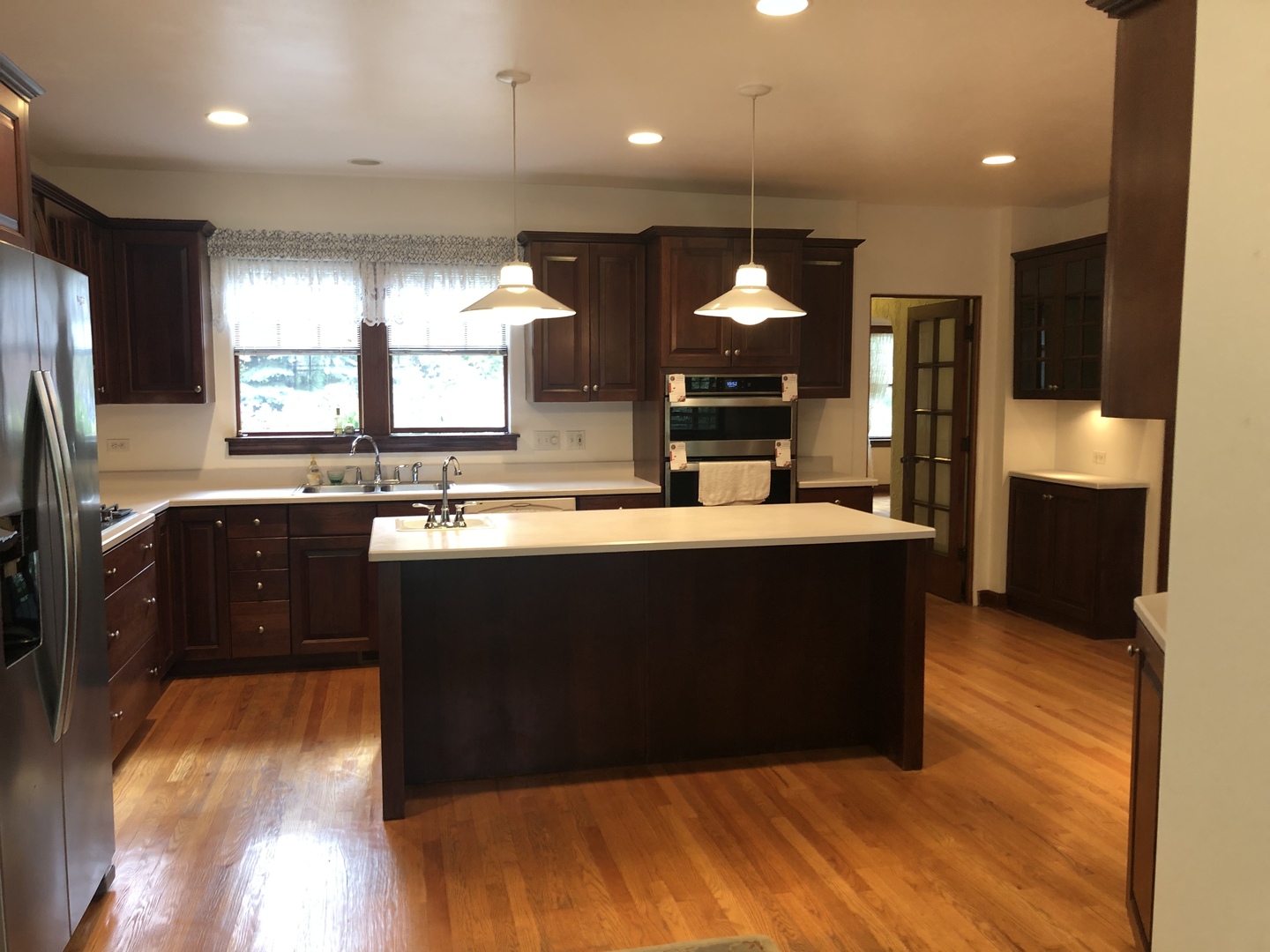 526 Longcommon Road Riverside, IL 60546 - Photo 4 of 40 a kitchen with stainless steel appliances granite countertop a sink a stove and a refrigerator