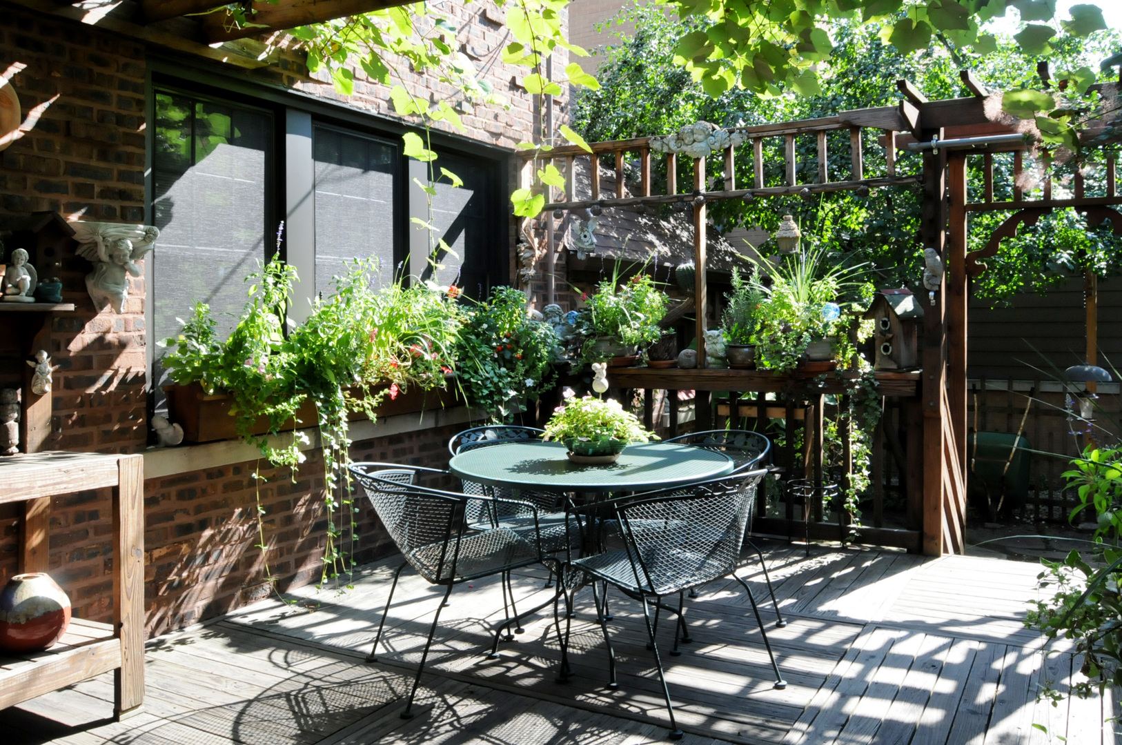 526 Longcommon Road Riverside, IL 60546 - Photo 31 of 40 a view of patio with table and chairs and potted plants