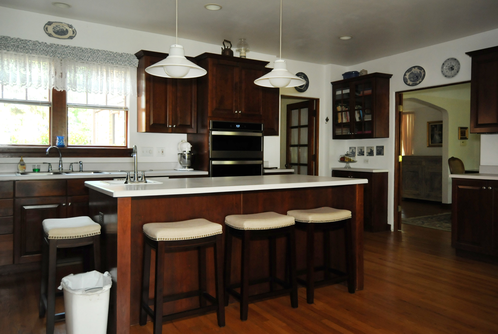 526 Longcommon Road Riverside, IL 60546 - Photo 5 of 40 a kitchen with granite countertop a table chairs sink and wooden floor