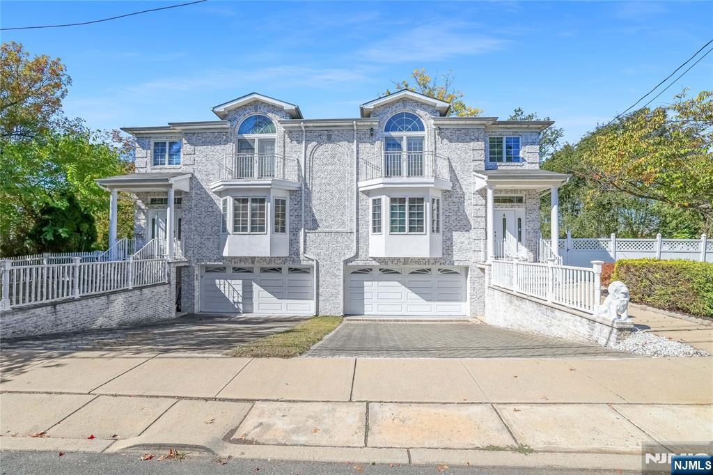 4 Maple Avenue Waldwick, NJ 07463 - Photo 1 of 34 a front view of a house with a garden
