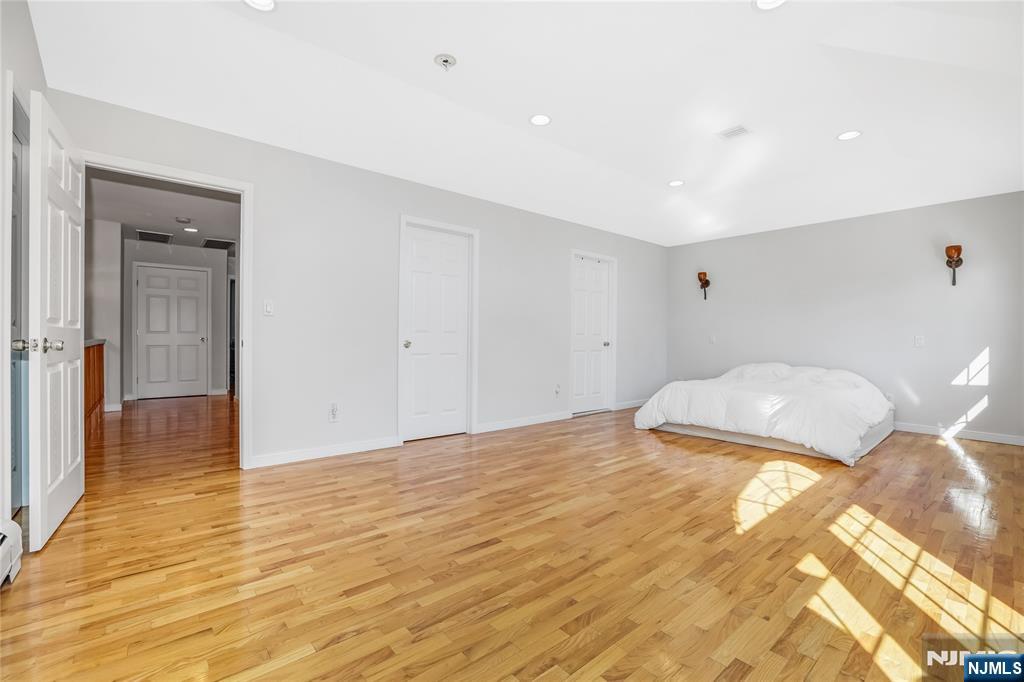 4 Maple Avenue Waldwick, NJ 07463 - Photo 16 of 34 a bedroom with a bed and a walk in closet