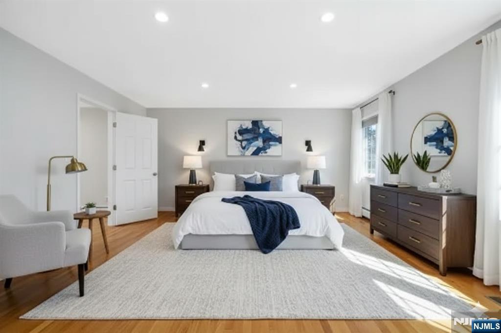 4 Maple Avenue Waldwick, NJ 07463 - Photo 17 of 34 a spacious bedroom with a bed and a dresser