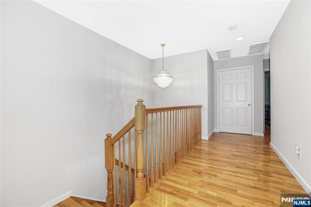 4 Maple Avenue Waldwick, NJ 07463 - Photo 20 of 34 a view of a hallway with wooden floor and staircase