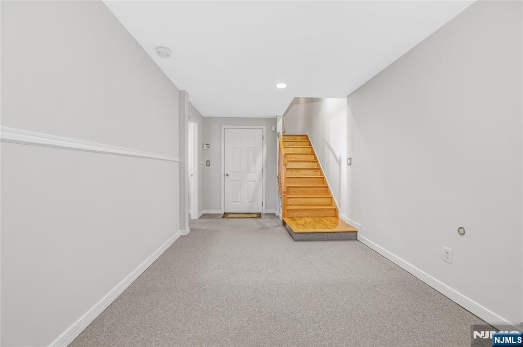 4 Maple Avenue Waldwick, NJ 07463 - Photo 29 of 34 an empty room with wooden floor and white walls