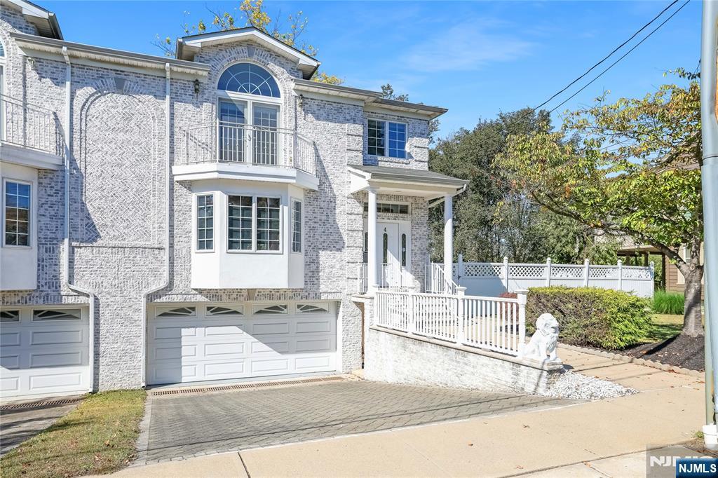 4 Maple Avenue Waldwick, NJ 07463 - Photo 3 of 34 a front view of a house with a garden