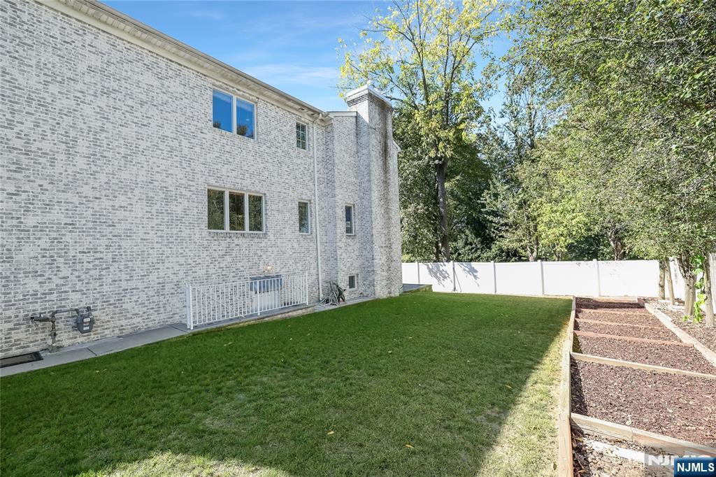 4 Maple Avenue Waldwick, NJ 07463 - Photo 31 of 34 a view of a backyard with a garden