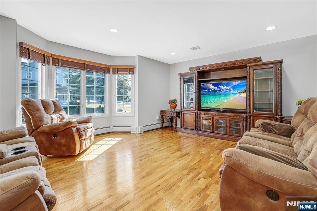 4 Maple Avenue Waldwick, NJ 07463 - Photo 4 of 34 a living room with furniture and a flat screen tv