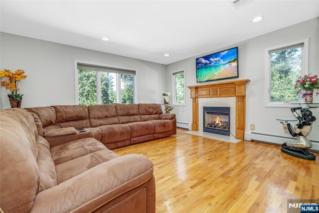 4 Maple Avenue Waldwick, NJ 07463 - Photo 5 of 34 a living room with furniture and a fireplace