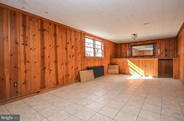 a view of yard with wooden fence