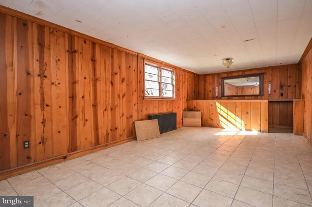 a view of yard with wooden fence