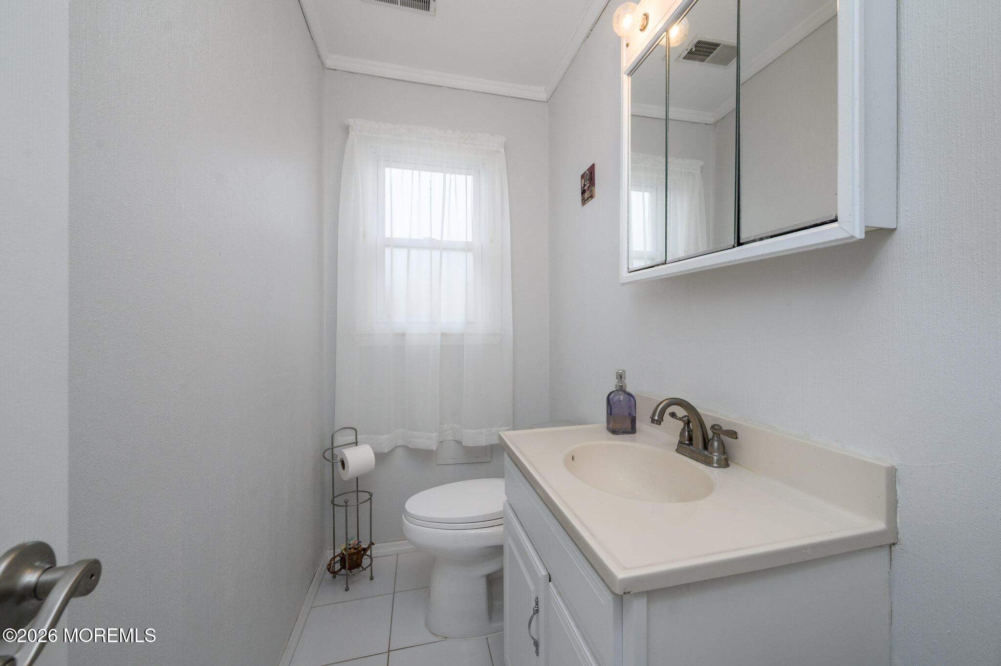 96 Cooper Boulevard Red Bank, NJ 07701 - Photo 21 of 26 a bathroom with a sink toilet and mirror