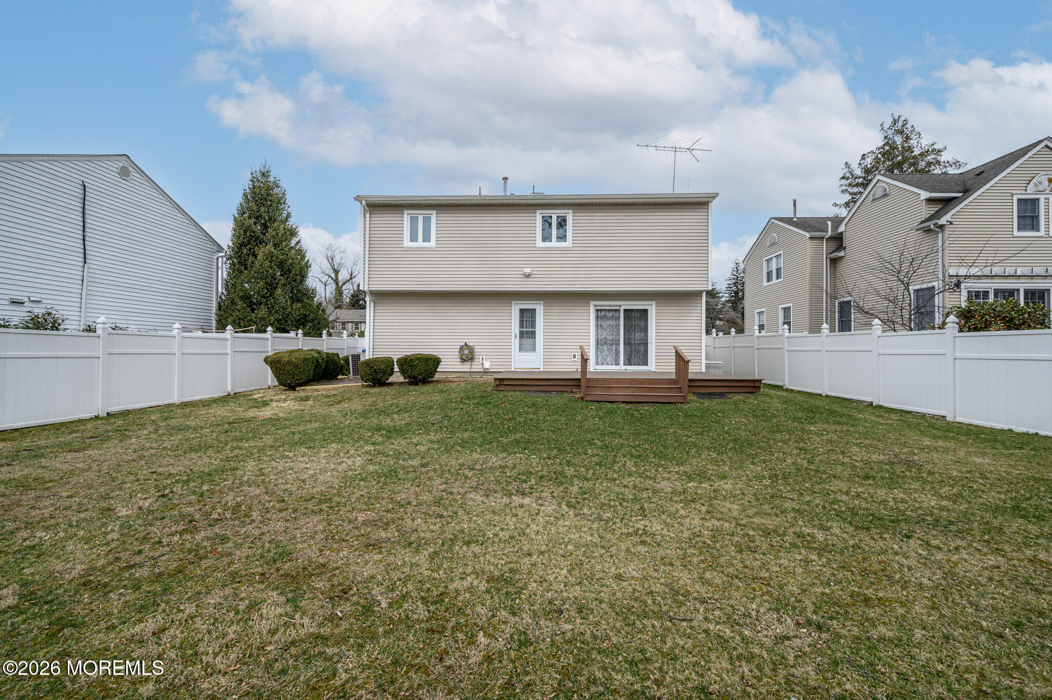 96 Cooper Boulevard Red Bank, NJ 07701 - Photo 25 of 26 a front view of house with yard and trees in the background