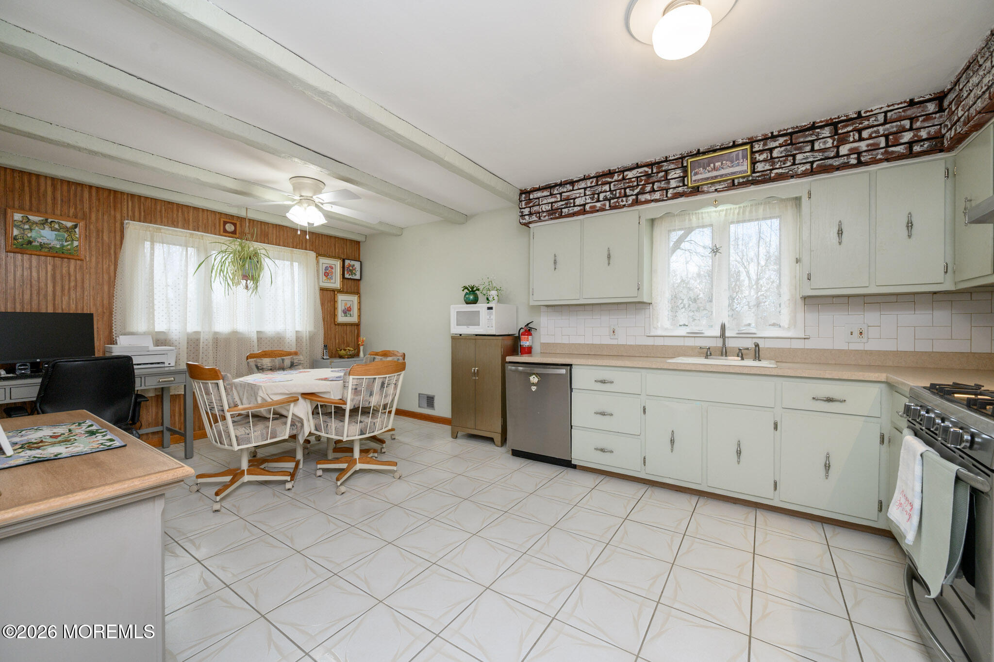 96 Cooper Boulevard Red Bank, NJ 07701 - Photo 7 of 26 a kitchen with a sink window and cabinets