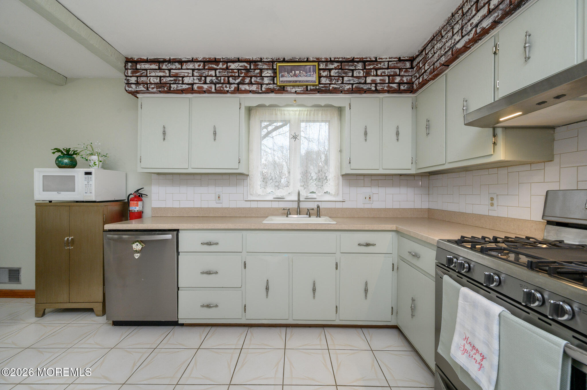96 Cooper Boulevard Red Bank, NJ 07701 - Photo 9 of 26 a kitchen with stainless steel appliances granite countertop a sink stove and cabinets