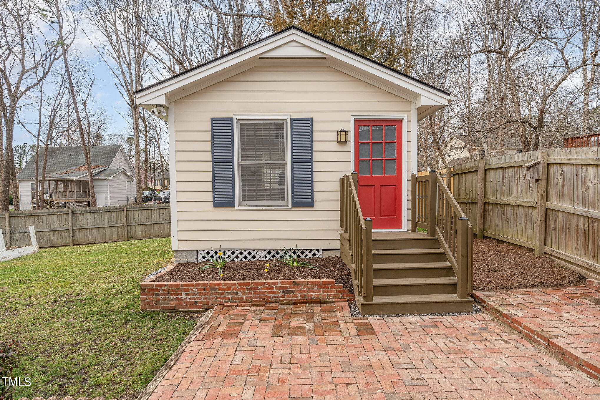7301 Old Hundred Road Raleigh, NC 27613 - Photo 14 of 17 a view of a house with a yard