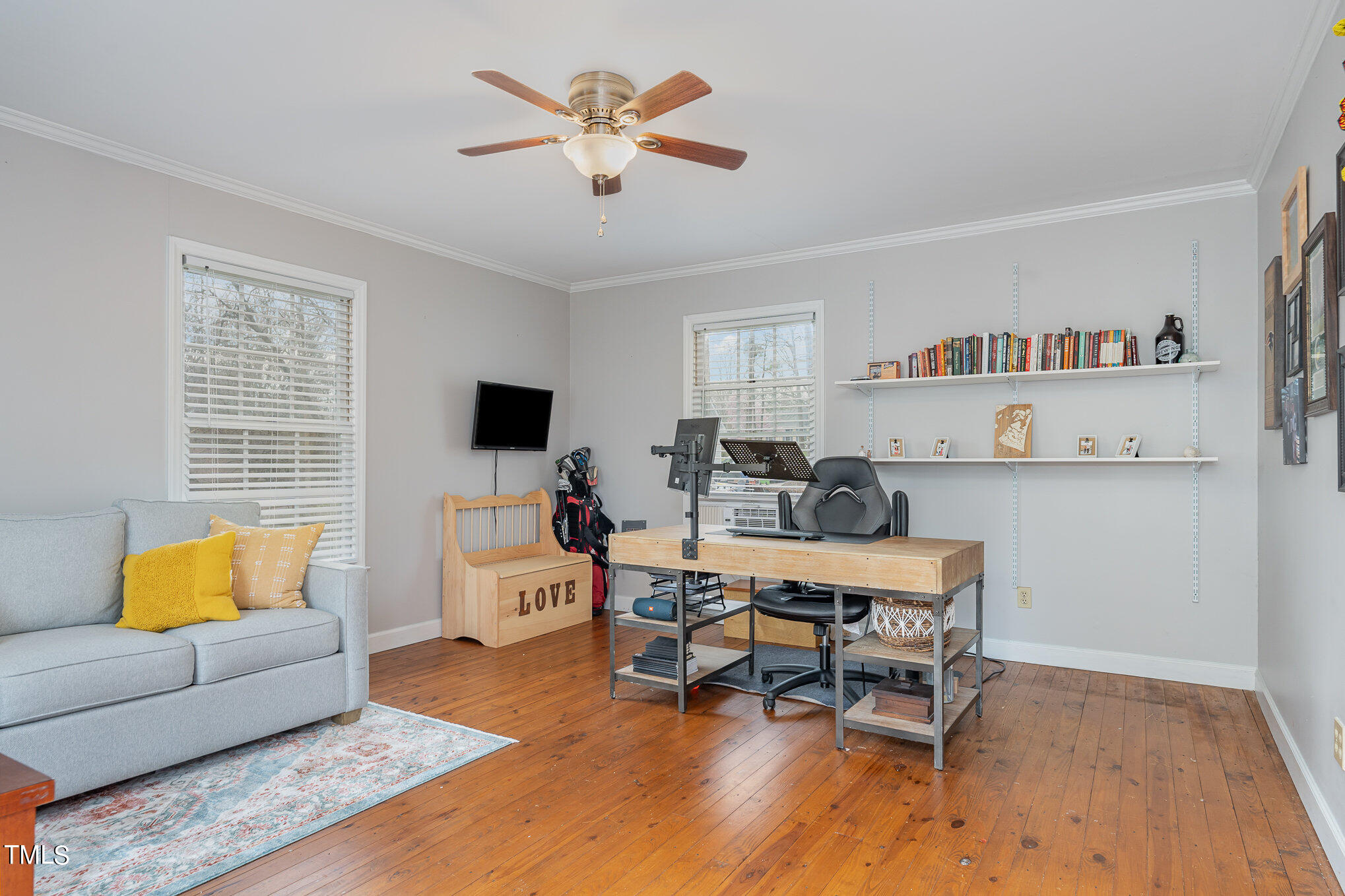 7301 Old Hundred Road Raleigh, NC 27613 - Photo 15 of 17 a living room with furniture and a flat screen tv