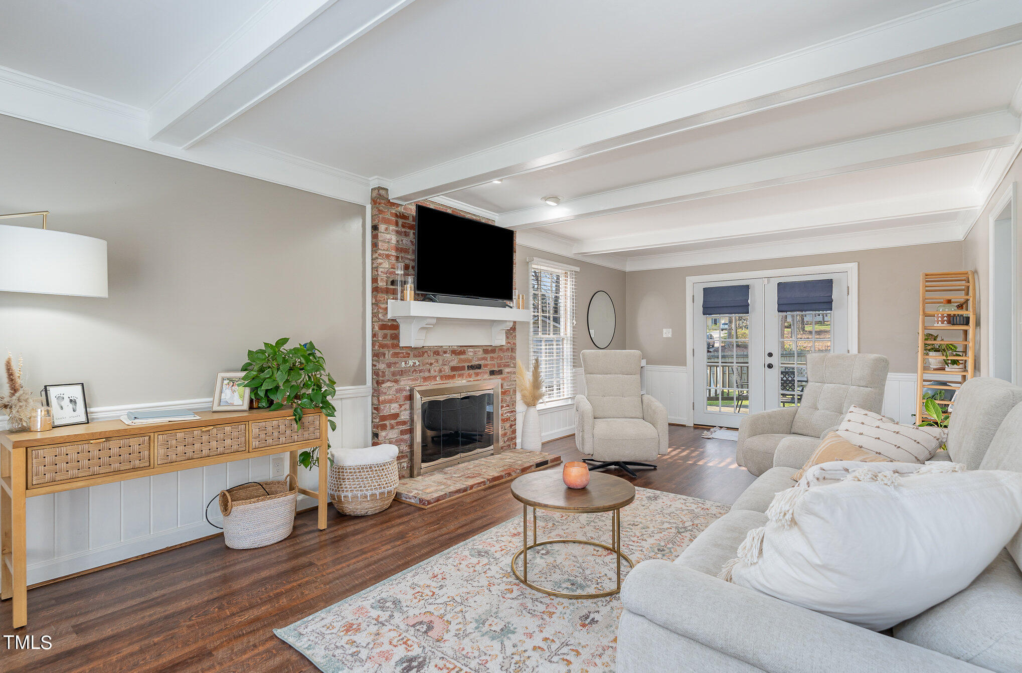 7301 Old Hundred Road Raleigh, NC 27613 - Photo 2 of 17 a living room with furniture and a fireplace