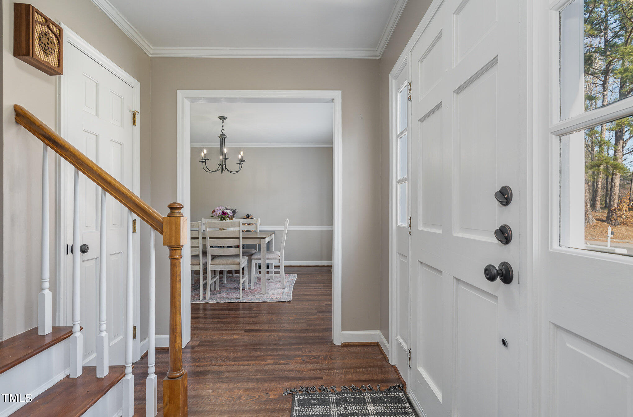 7301 Old Hundred Road Raleigh, NC 27613 - Photo 3 of 17 a view of a hallway with wooden floor and entryway
