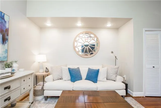 a living room with furniture and a lamp