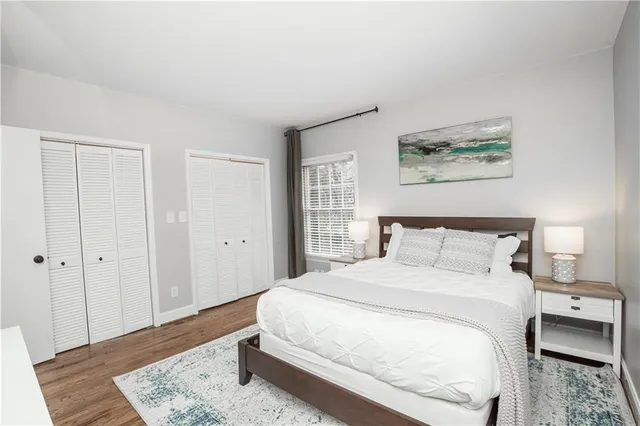 a large bed in a white room