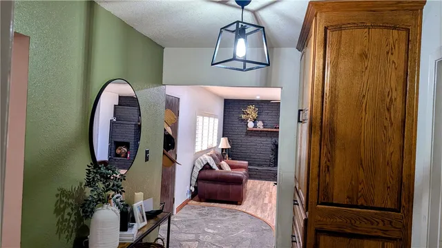 a living room with furniture and a mirror