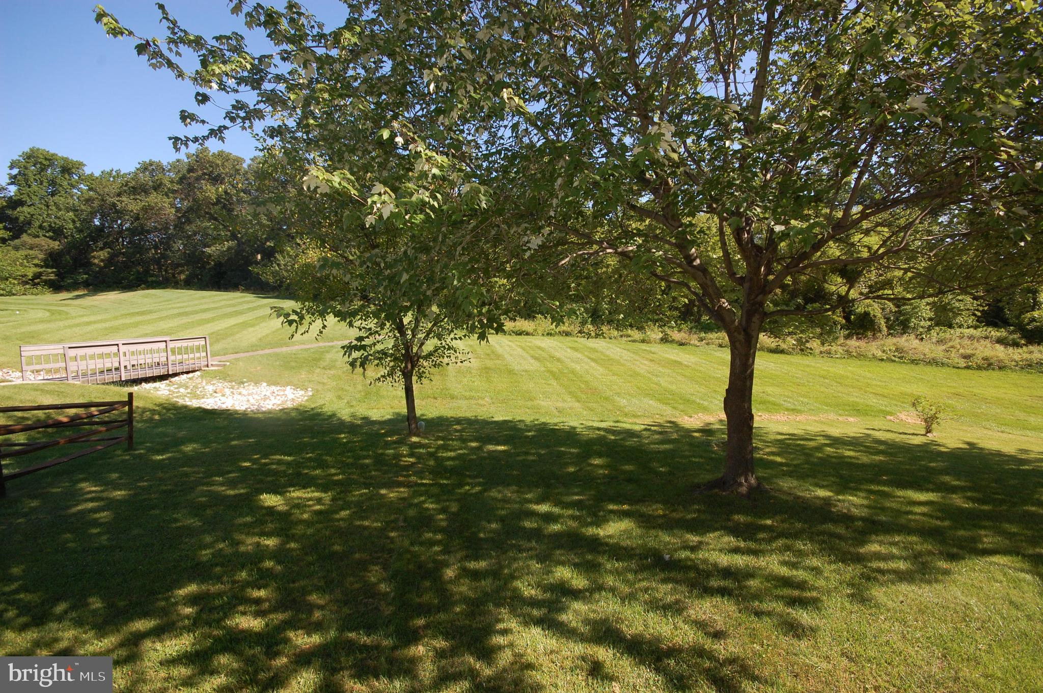 7975 Millstream Court Elkridge, MD 21075 - Photo 14 of 15 Backyard view of open space and backing to trees