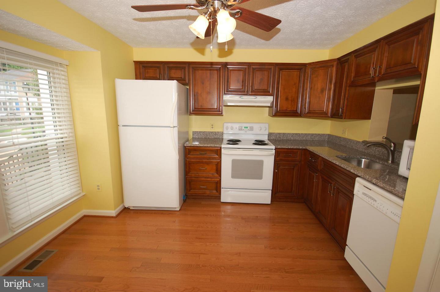 7975 Millstream Court Elkridge, MD 21075 - Photo 3 of 15 New cabinetry and bright white appliances