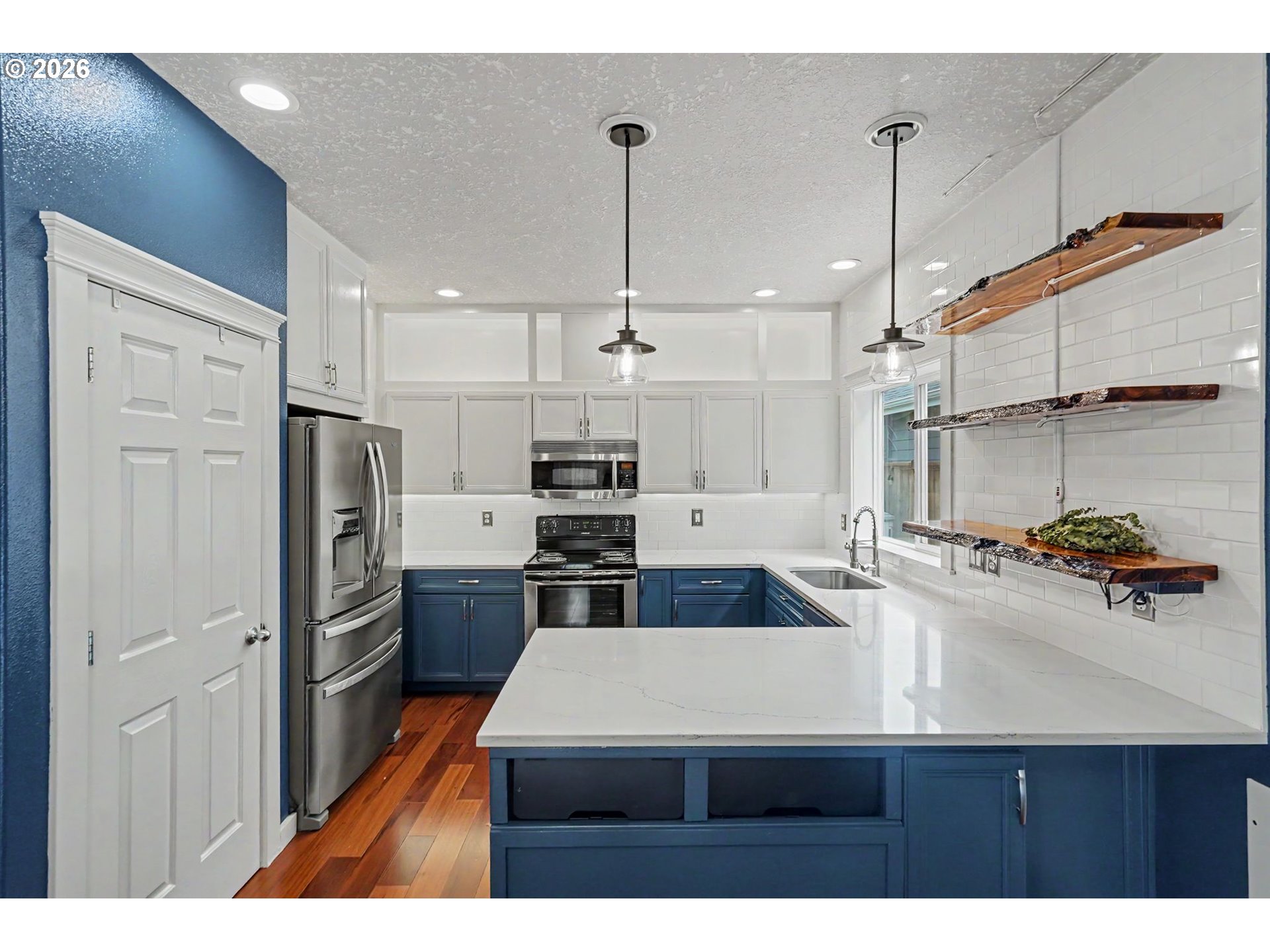 1462 Barnick Road Northeast Keizer, OR 97303 - Photo 19 of 48 a kitchen with kitchen island a sink stainless steel appliances and cabinets