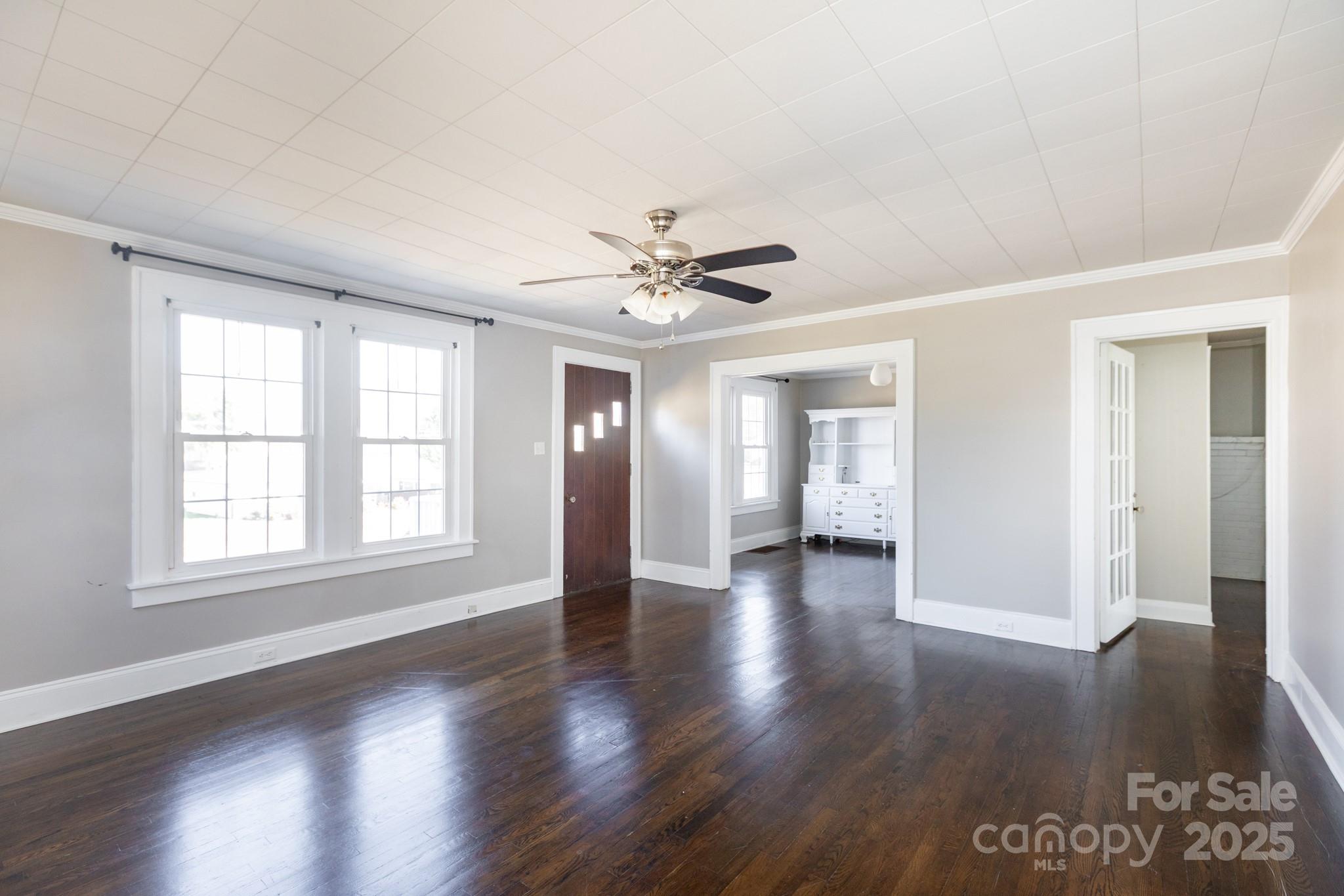 1402 Brantley Road Kannapolis, NC 28083 - Photo 11 of 27 a view of an empty room with wooden floor and a window