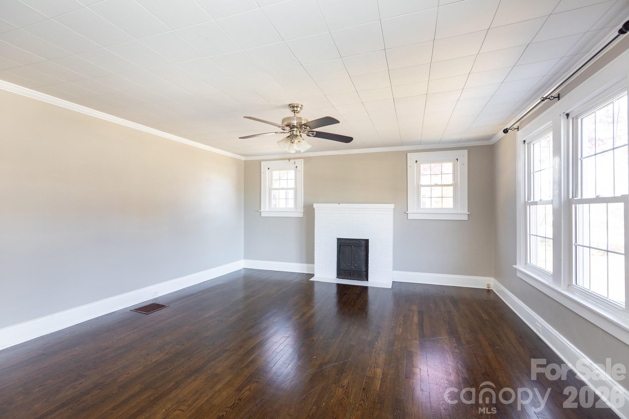 1402 Brantley Road Kannapolis, NC 28083 - Photo 13 of 29 a view of empty room with wooden floor and fan