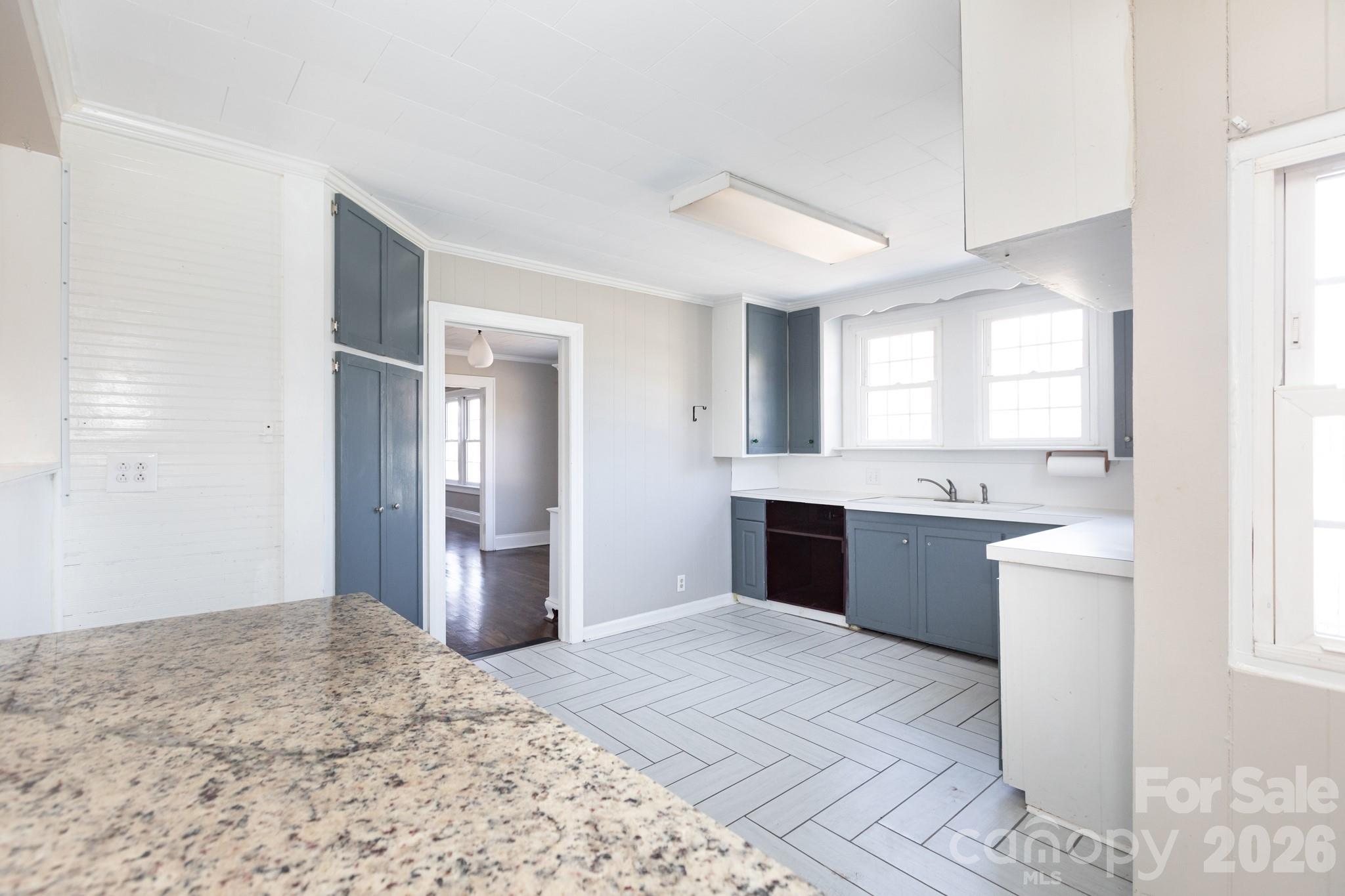 1402 Brantley Road Kannapolis, NC 28083 - Photo 16 of 29 a large white kitchen with a stove and refrigerator