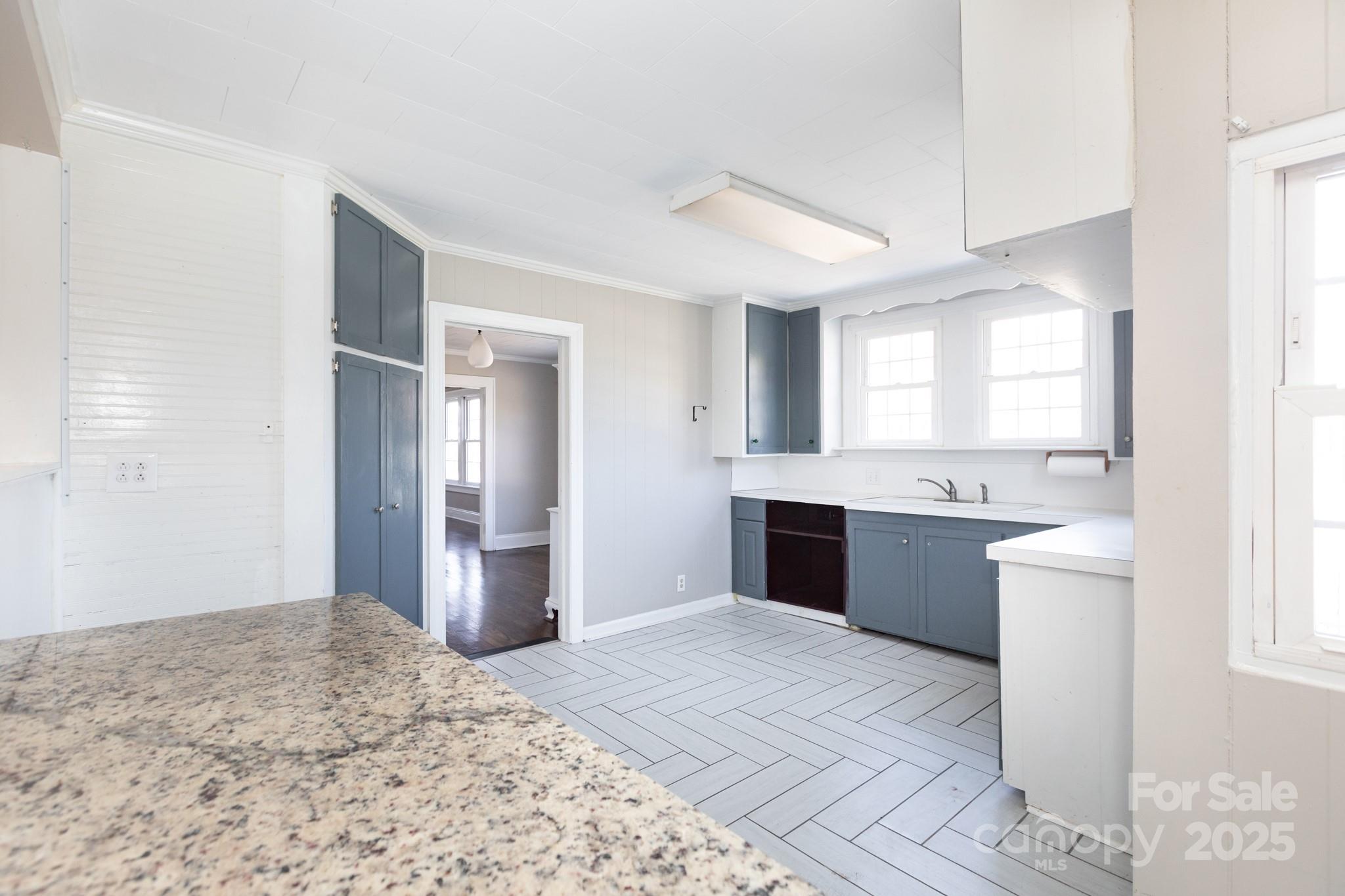 1402 Brantley Road Kannapolis, NC 28083 - Photo 8 of 24 a large white kitchen with a stove and refrigerator