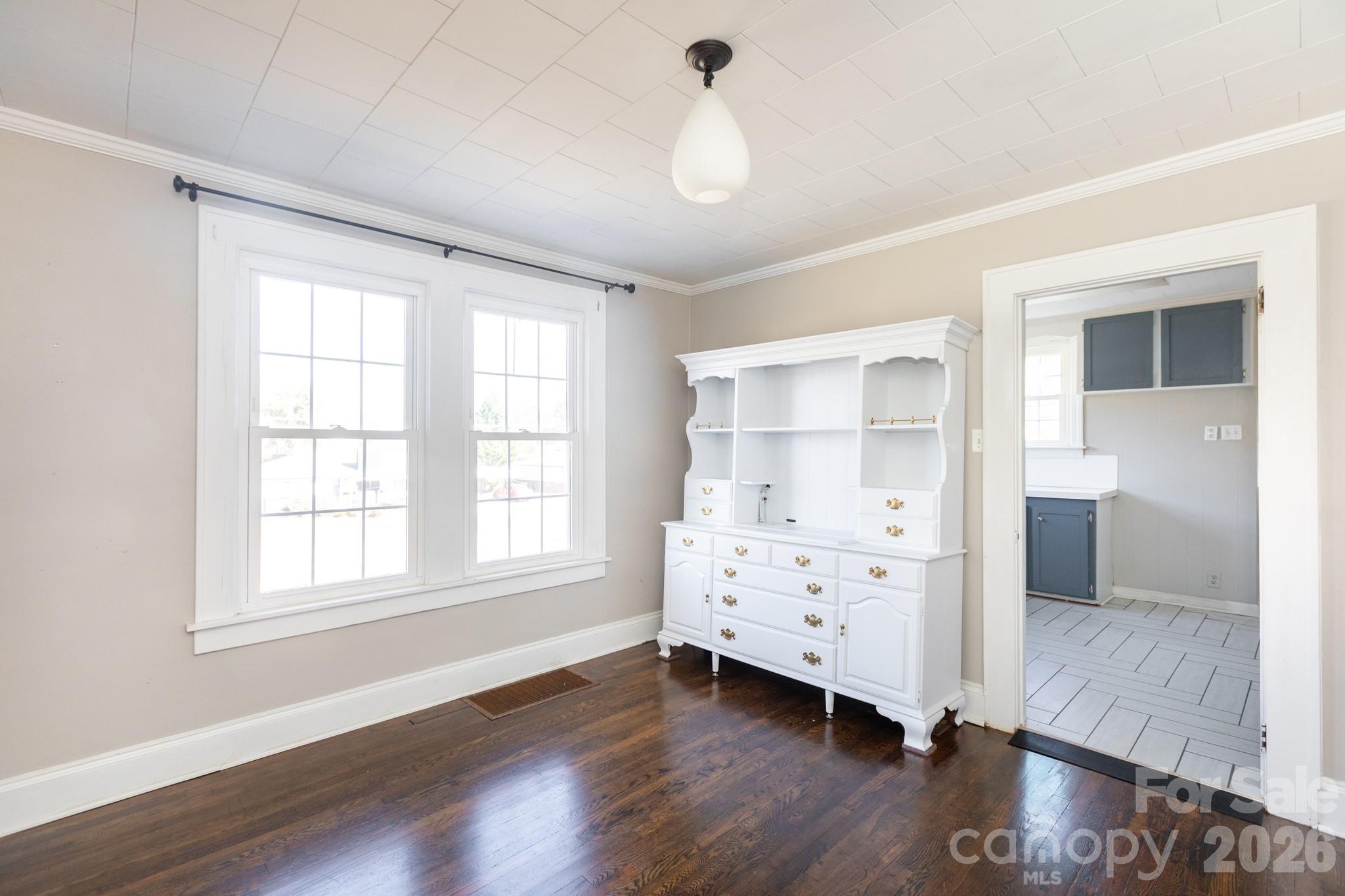 1402 Brantley Road Kannapolis, NC 28083 - Photo 9 of 29 a view of a bedroom with wooden floor closet and windows