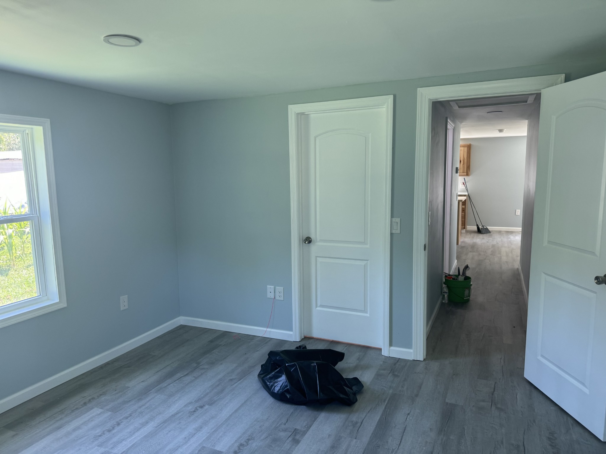 499 Carter Blake Road Tullahoma, TN 37388 - Photo 9 of 15 an empty room with wooden floor and windows