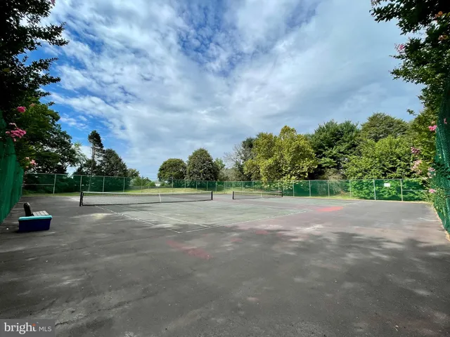 a view of a street with a yard
