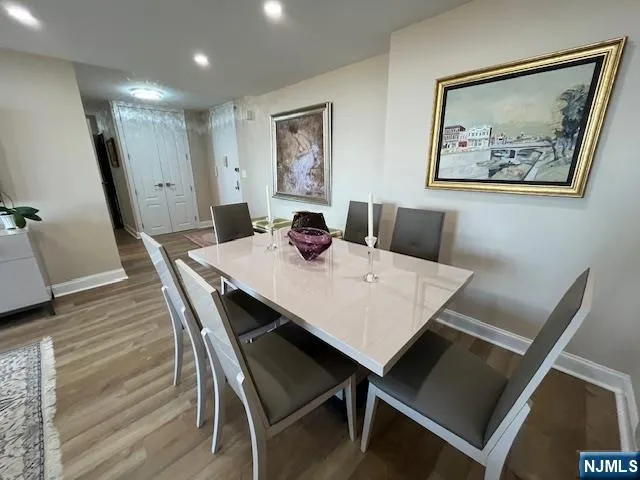 a room with furniture a flat screen tv and a fireplace