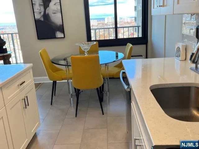a bedroom with a bed wooden floor and a flat tv screen