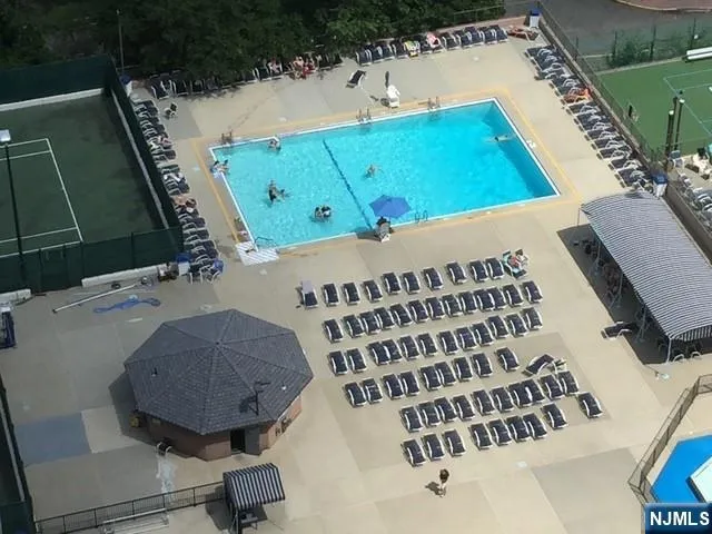 a kitchen with a sink appliances and cabinets