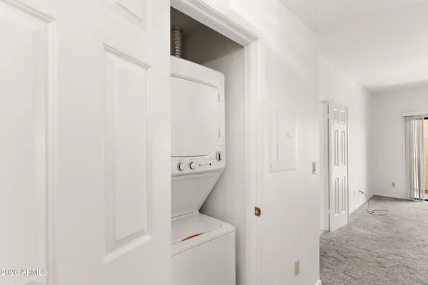 a kitchen with a refrigerator sink and cabinets