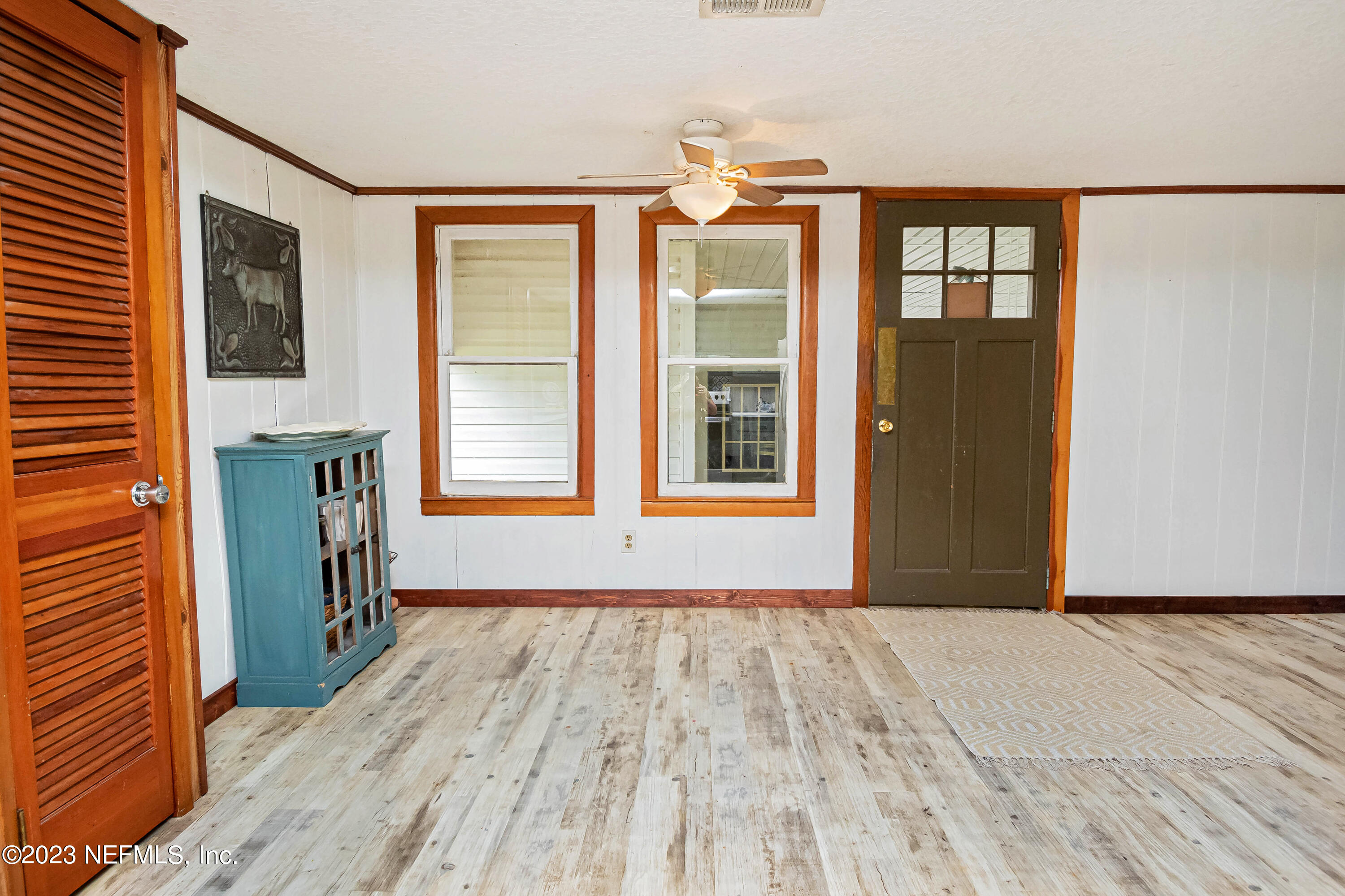 8619 Mud Lake Road Macclenny, FL 32063 - Photo 12 of 49 a view of empty room with windows and wooden floor