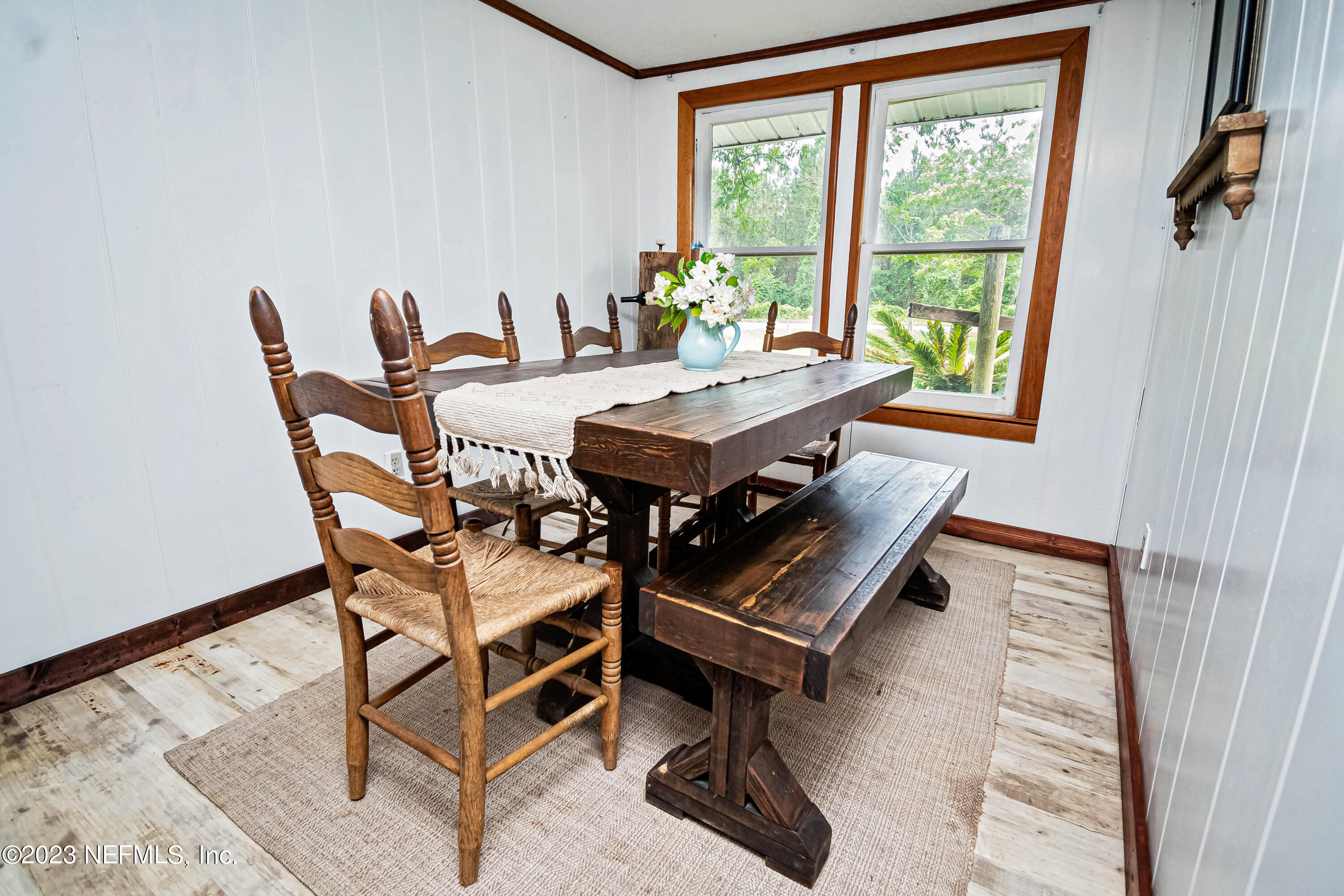 8619 Mud Lake Road Macclenny, FL 32063 - Photo 13 of 49 a dining room with furniture and wooden floor
