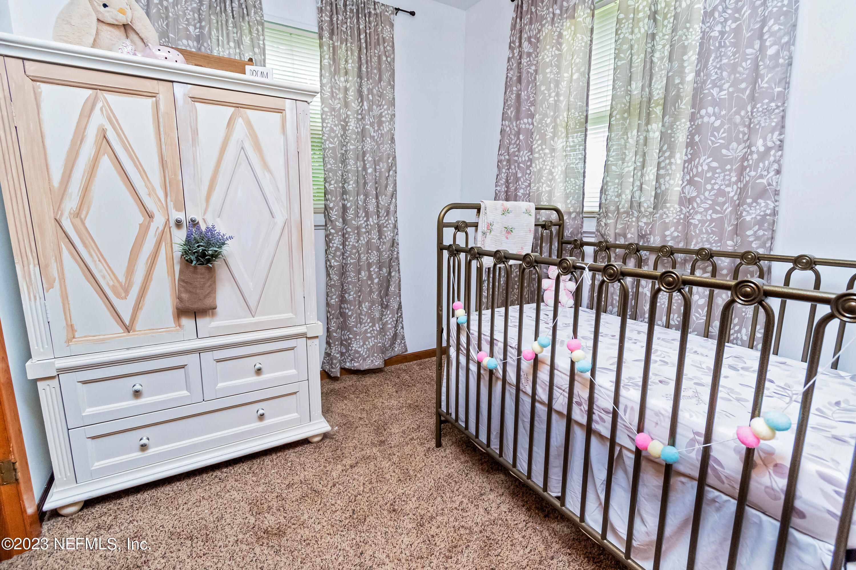 8619 Mud Lake Road Macclenny, FL 32063 - Photo 18 of 49 a view of a bedroom with windows