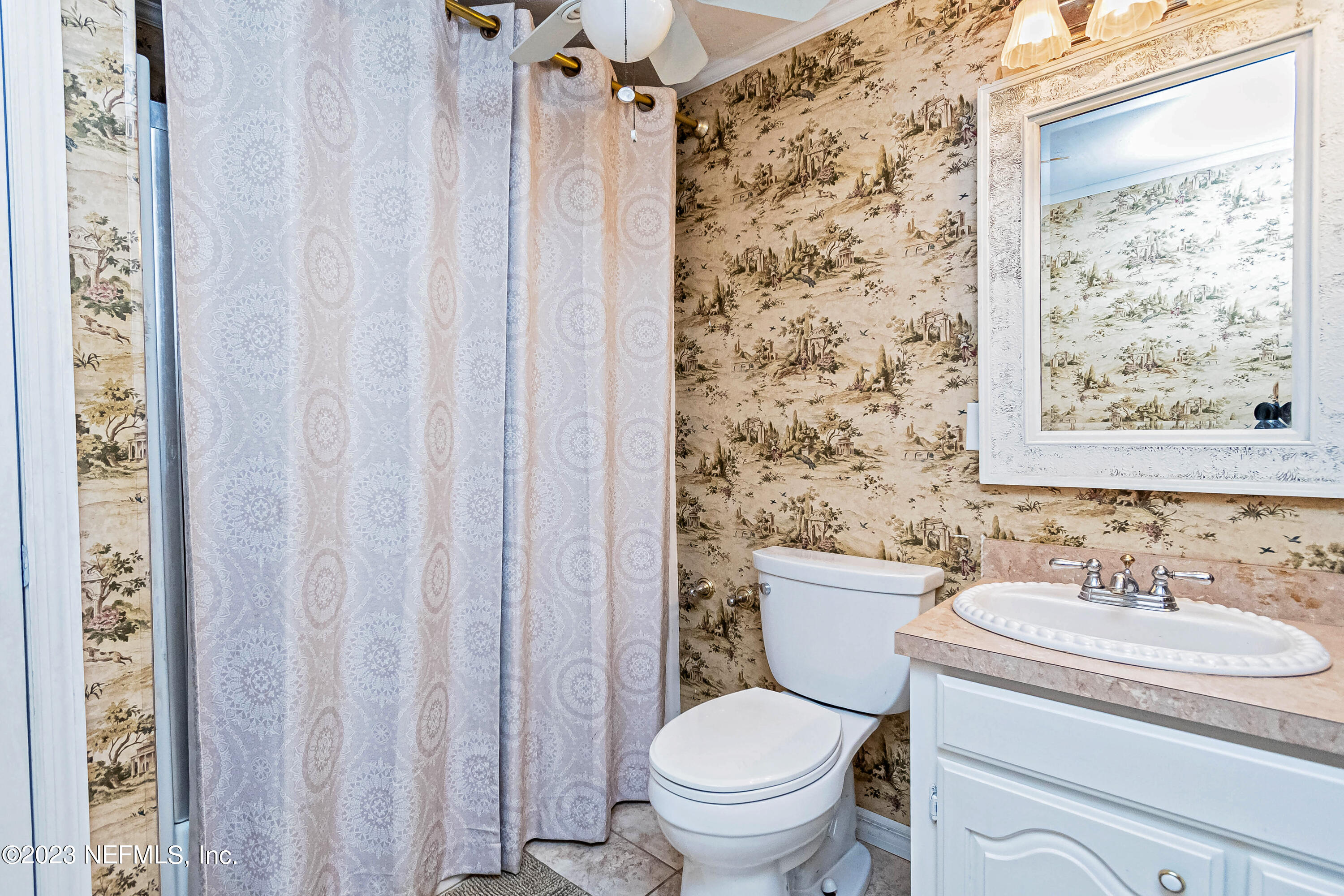 8619 Mud Lake Road Macclenny, FL 32063 - Photo 21 of 49 a bathroom with a sink toilet and shower