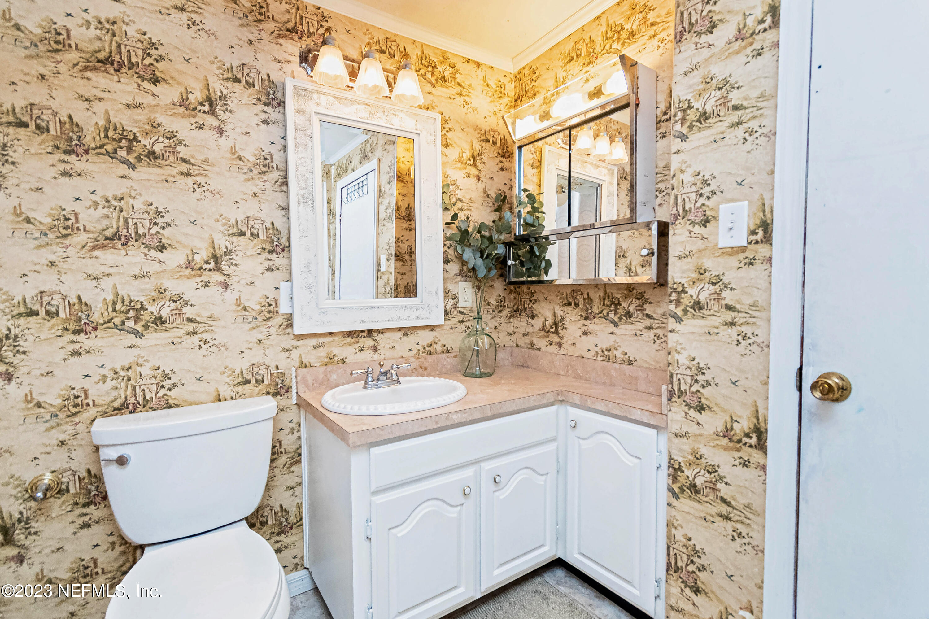 8619 Mud Lake Road Macclenny, FL 32063 - Photo 22 of 49 a bathroom with a toilet sink and mirror