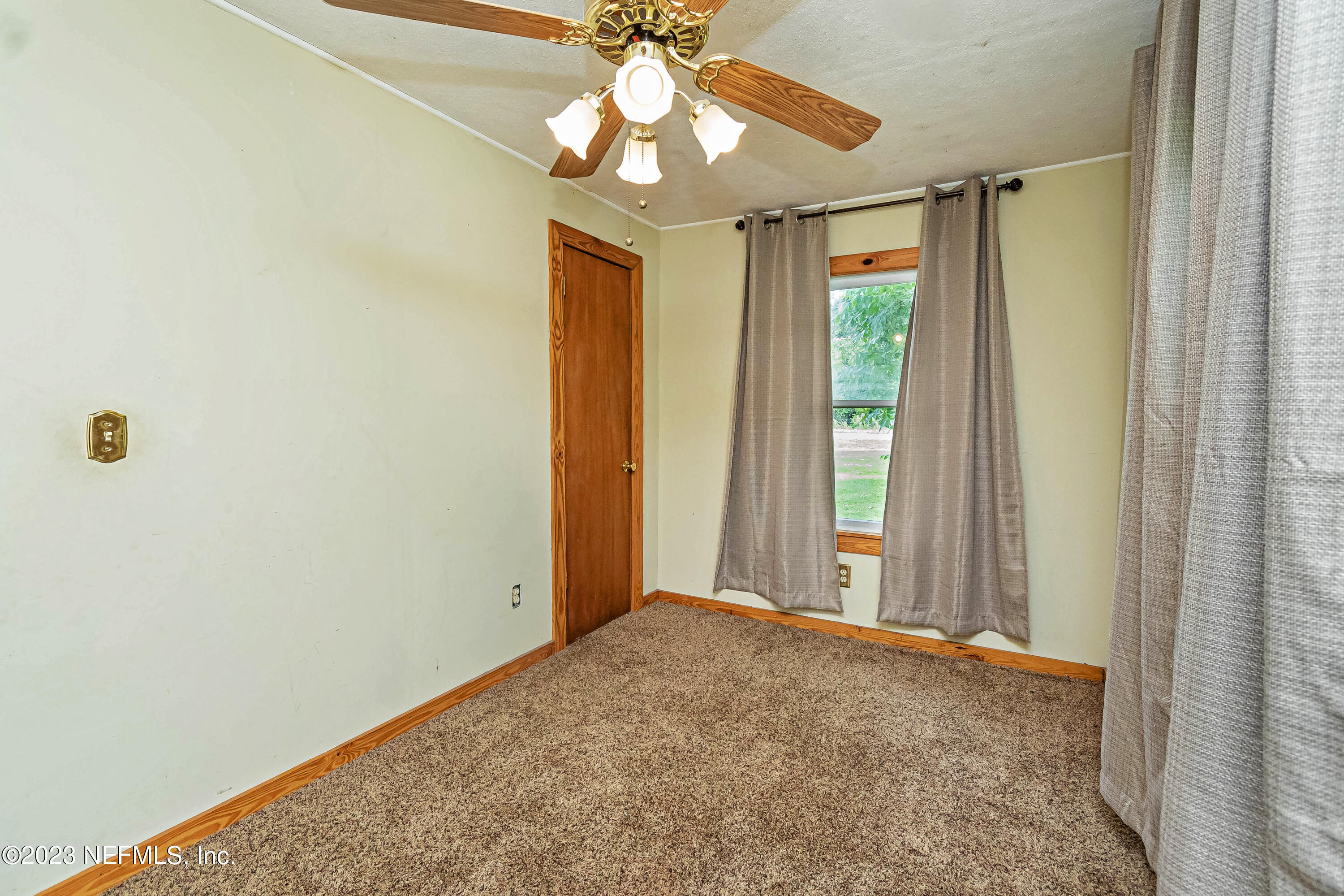 8619 Mud Lake Road Macclenny, FL 32063 - Photo 23 of 49 a view of livingroom with window and ceiling fan