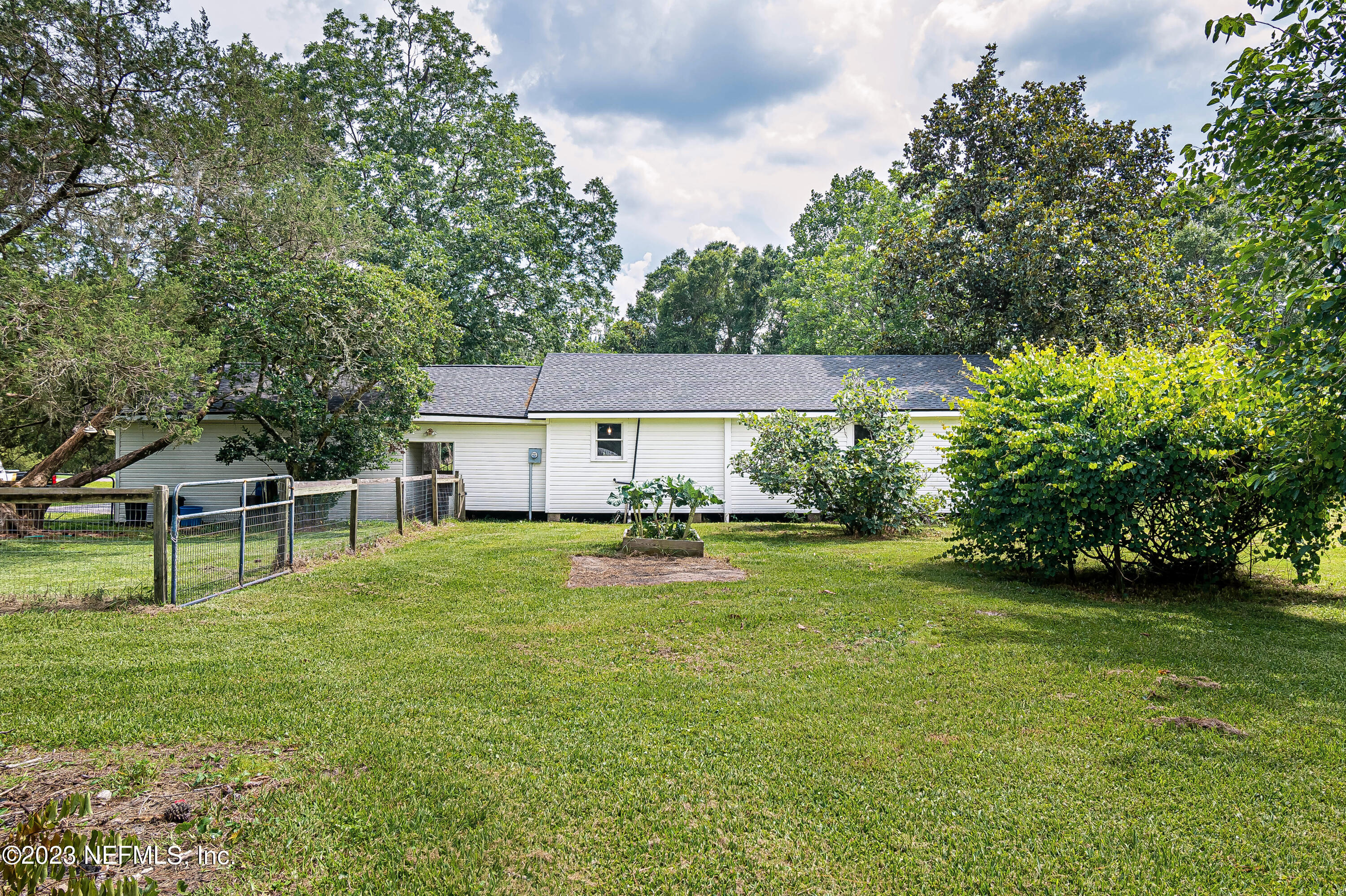 8619 Mud Lake Road Macclenny, FL 32063 - Photo 26 of 49 a house view with a sitting space and garden